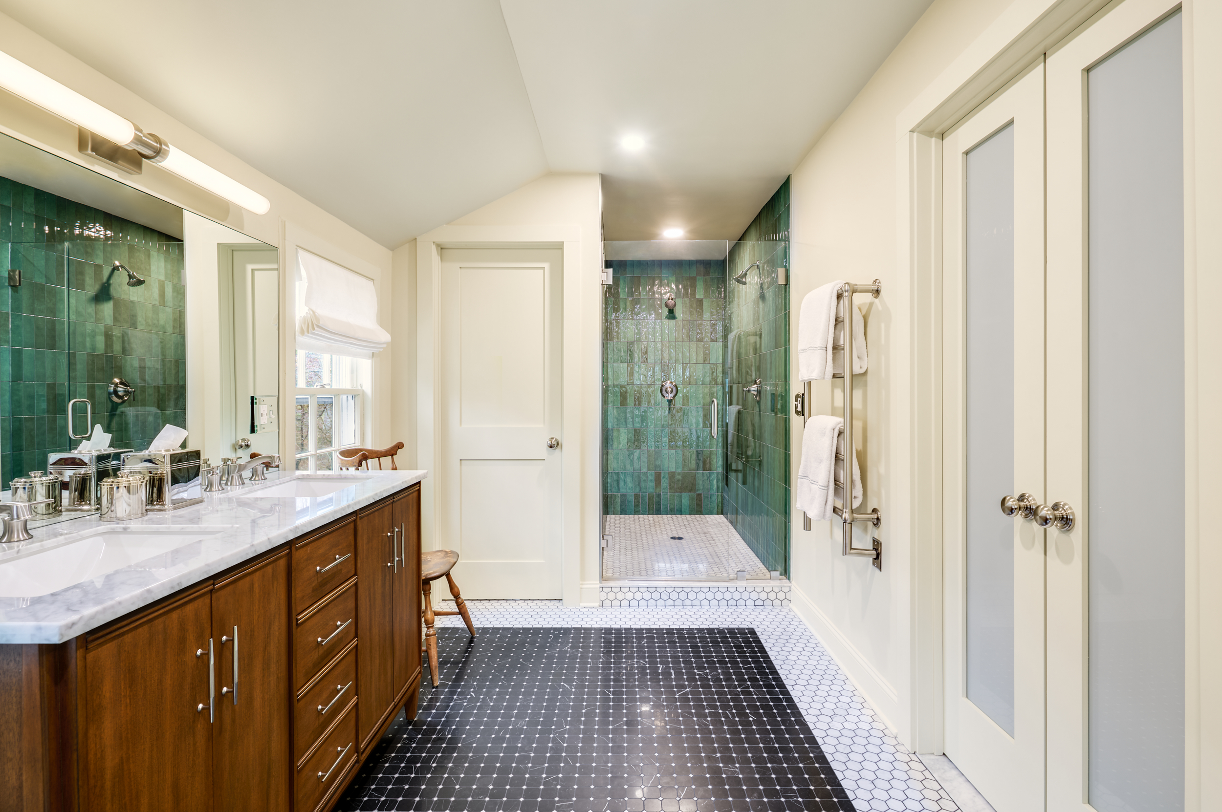 Primary Bathroom With a Green Tiled Shower